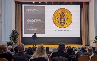 Matt Willey giving a presentation at the Rivian Theater