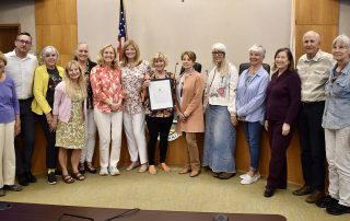 Members posing with certificate for Bee Day proclamation at Laguna Beach City Council meeting